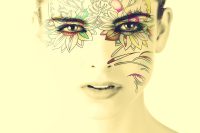 Illustrated floral face tattoo design around a woman's eyes and cheek