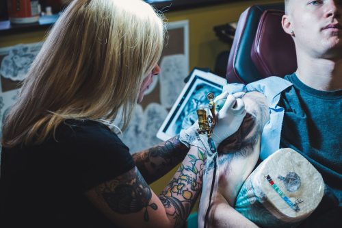 Woman's Husband Gets Face Tattooed on His Thigh