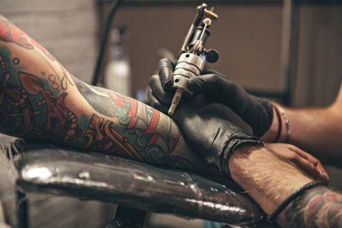 Woman's Husband Gets Face Tattooed on His Thigh